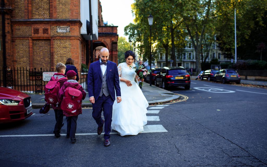Newlyweds-walking-down-a-London-street-scaled.