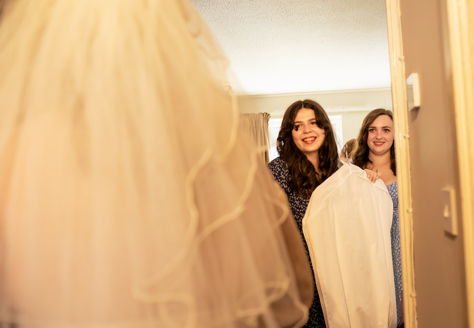 Bridesmaids-first-look-reaction-to-bride-in-wedding-dress