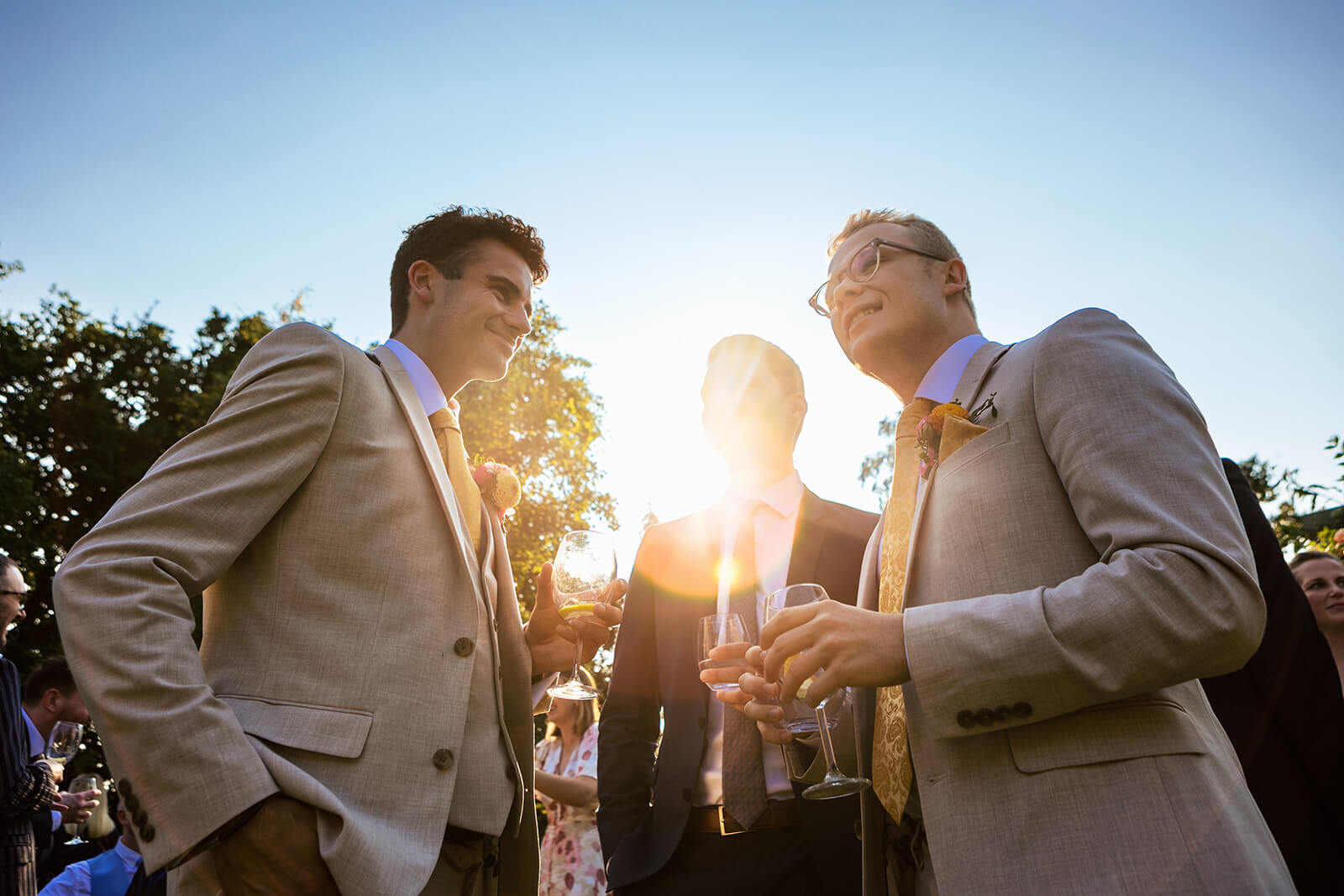 Groom and his friends holding drinks