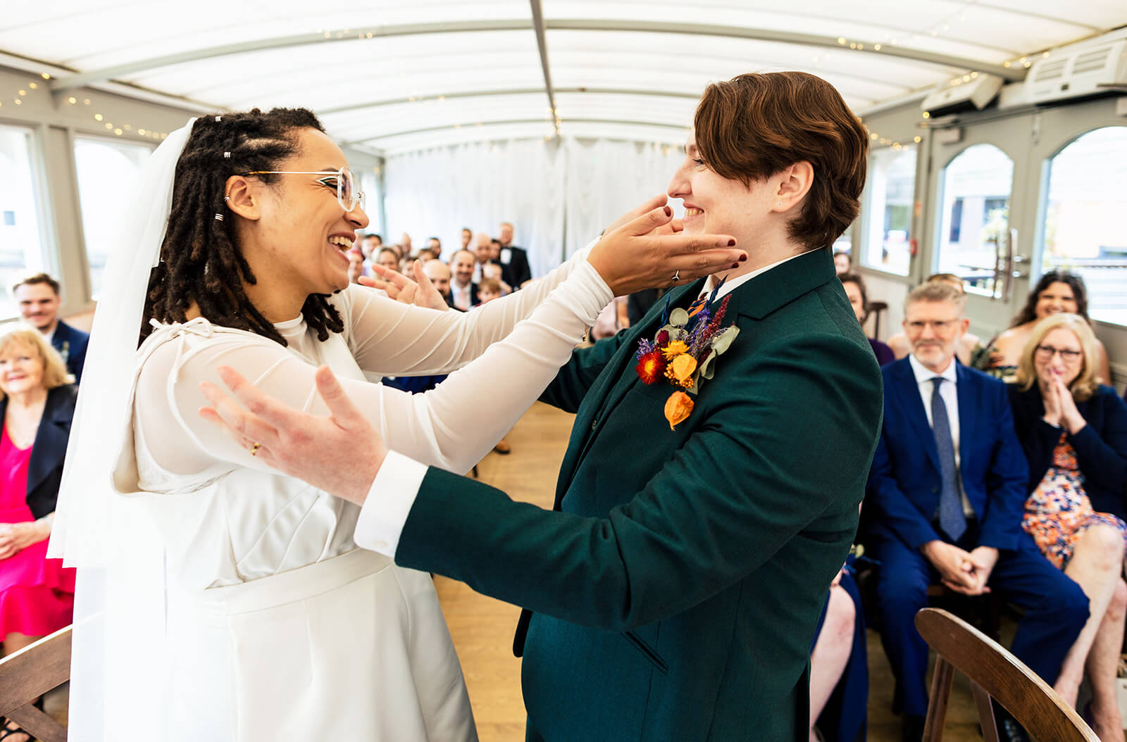 Bride and bride first kiss at wedding