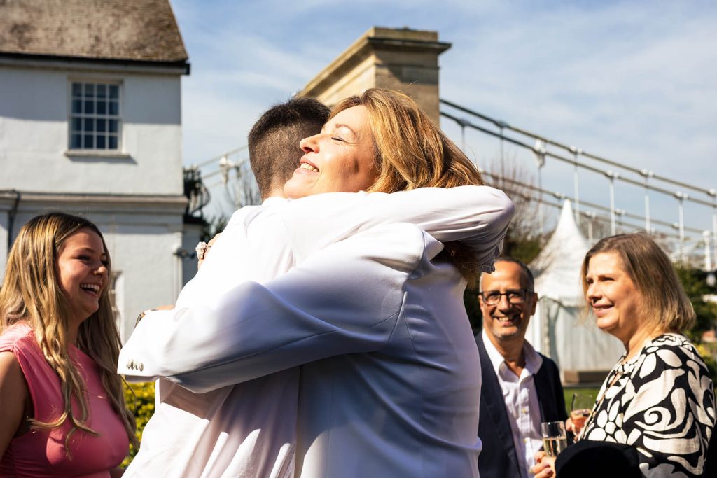 Marlow UK bride hugging a wedding guest
