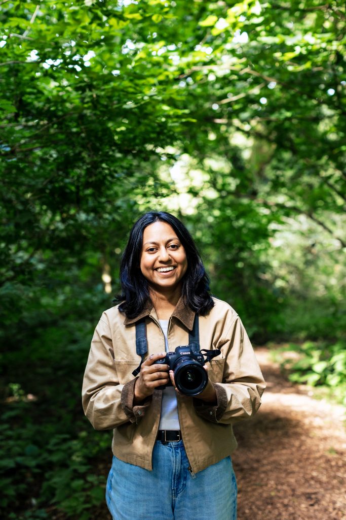 Halema, wedding photographer, holding a camera